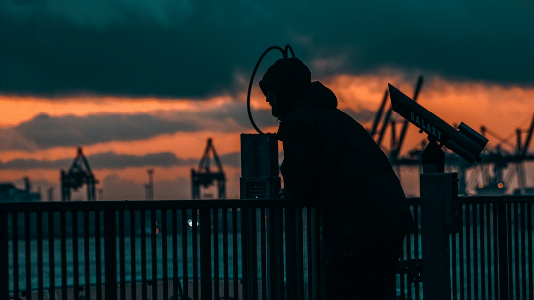 Oilfield worker documenting industrial machinery and hazard conditions on a drilling site Oilfield worker documenting industrial machinery and hazard conditions on a drilling site